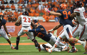Syracuse takes on Louisville at 12:30 p.m. on Saturday. In 2014 (pictured above), the Cardinals beat the Orange 28-6.