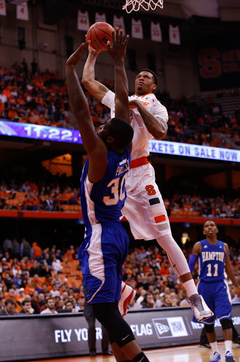 Freshman forward Chris McCullough rises up over Hampton forward Jervon Pressley. 