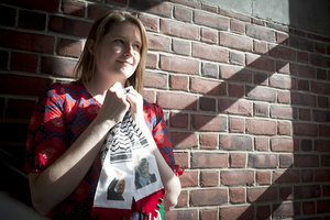 Amanda Claypool, a senior international relations, political science and history major, holds the scarf she received as a gift while traveling abroad in the West Bank last December in order to do first-hand research for her capstone project on the Israeli-Palenstinian conflict