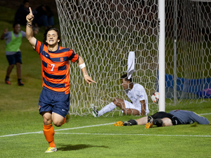 Freshman Alex Halis celebrates after scoring a goal against Manhattan. Halis logged two goals and an assist as the Orange cruised to a 4-1 win.