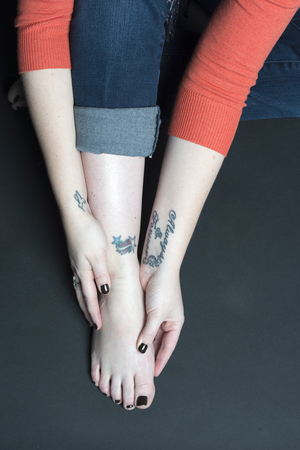 Washburn's tattoos include a hummingbird for her grandmother, a heart with a bandage and two stars to represent an autoimmune condition she has, and a seahorse to represent her husband.