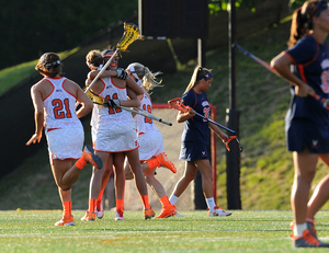 Alyssa Murray hugs fellow senior Amy Cross as the Orange beats Virginia 16-8 to advance to the NCAA championship game. 