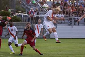 Emil Eklbom connects with a header in front of the net in Syracuse's 3-0 win against St. Mary's on Sunday night. 