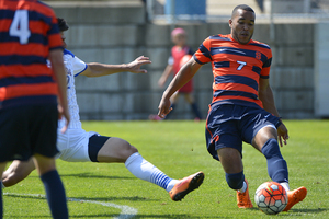 Ben Polk looks to dish off a pass to Liam Callagan. Polk transferred from Herkimer Community College and collected two assists in his debut with SU.