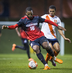 Noah Rhynhart (12) had to fill a different role than usual against Hartford on Tuesday night at SU Soccer Stadium. Syracuse and Hartford tied 2-2.