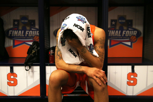 Malachi Richardson laments Syracuse's loss in the locker room after the game. He scored 17 points and shot 7-of-14 from the field. 