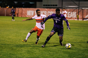 Mo Adams works to track down a Northwestern player Sunday night. 