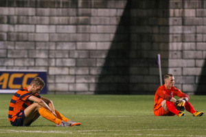 After Syracuse lost to Duke on Sept. 22, two Orange players sat on the turf to process the game. It was Syracuse's third consecutive loss at home is the first since 2009.