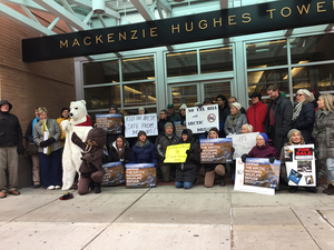 About 30 people gathered in front of U.S. Rep. John Katko's office in downtown Syracuse to protest drilling in  the Arctic National Wildlife Refuge. 