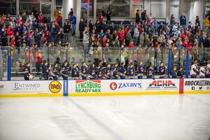 Syracuse men's club ice hockey stands for the national anthem in a previous game. 