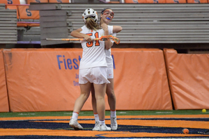 Syracuse players celebrate a goal. The Orange repeated a similar celebration 18 other times on Thursday. 