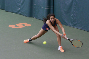 Dina Hegab stretches for a return.