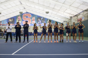 Syracuse stands in a line pregame.