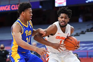 Quincy Guerrier breaks through Pittsburgh defense on a drive to the net in Syracuse's 63-60 loss against Pitt.