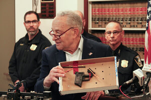 Senator Chuck Schumer shows an example of a 