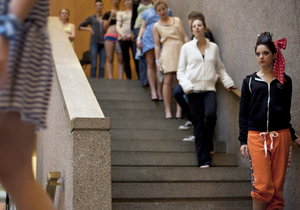 Models line the stairs of Newhouse 1, preparing to walk the runway at the Fashion Communication Milestone Program Cent$ and Sensibility fashion show Friday night. Freshman, sophomore and juniors showcased their designs, created with a $50 maximum budget