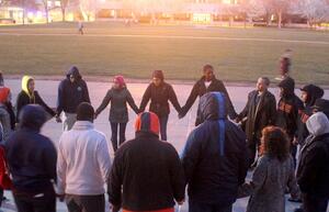 Students honor Martin Luther King Jr. and Trayvon Martin during a vigil held in front of Hendricks Chapel Wednseday night. Participants took turns reading poetry and delivering speeches.