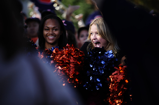 Sarah Haines cheers with the SU cheerleaders.