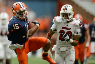 Alec Lemon makes a catch in front of a Louisville defender.