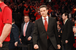 Rick Pitino walks onto the court at Madison Square Garden.