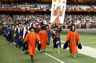 Undergraduates in the College of Arts and Sciences march to their seats during the 2013 commencement ceremony inside the Carrier Dome.