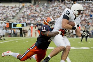 Marquis Spruill tackles 6-foot-7, 257-pound tight end Jesse James. 