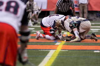 Daddio sets up for a faceoff against Notre Dame specialist Liam O'Connor.  