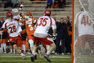 Ward gets ready to shoot the ball past Cornell defender Jordan Stevens.  