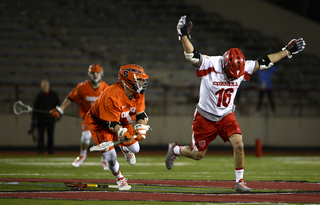 Cornell's Doug Tesoriero loses his stick and the faceoff against Daddio. 