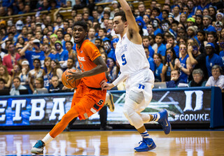 B.J. Johnson, left, drives his way around Tyus Jones in the paint.