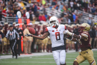 Ishmael extends his right arm out to try and make a one-handed grab.