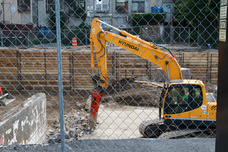 Crews use heavy construction equipment to complete the South Crouse Avenue project. Photo taken Aug. 1, 2017