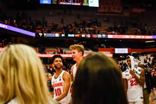 Syracuse players walk off the court after the win.