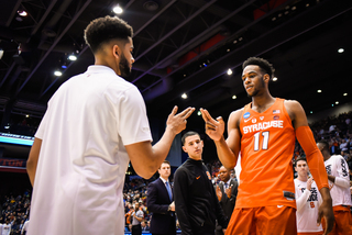 Howard Washington, a freshman guard who sustained a season-ending injury, led the team handshakes during lineup introductions.