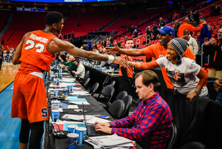 Howard reaches over to the fans before leaving the court. Despite the game ending after midnight, a strong contingent of SU fans remained in attendance.