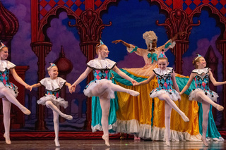 Mother Ginger and all the little Gingers dance across the stage in joker-inspired costumes. The Gingers were danced by six of Syracuse City Ballet’s 80 youth dancers. 